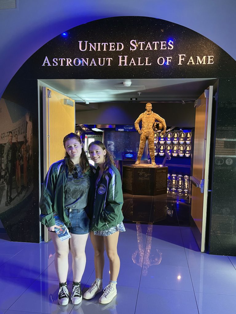 Image of two teen girls standing in front of United States Astronaut Hall of Fame