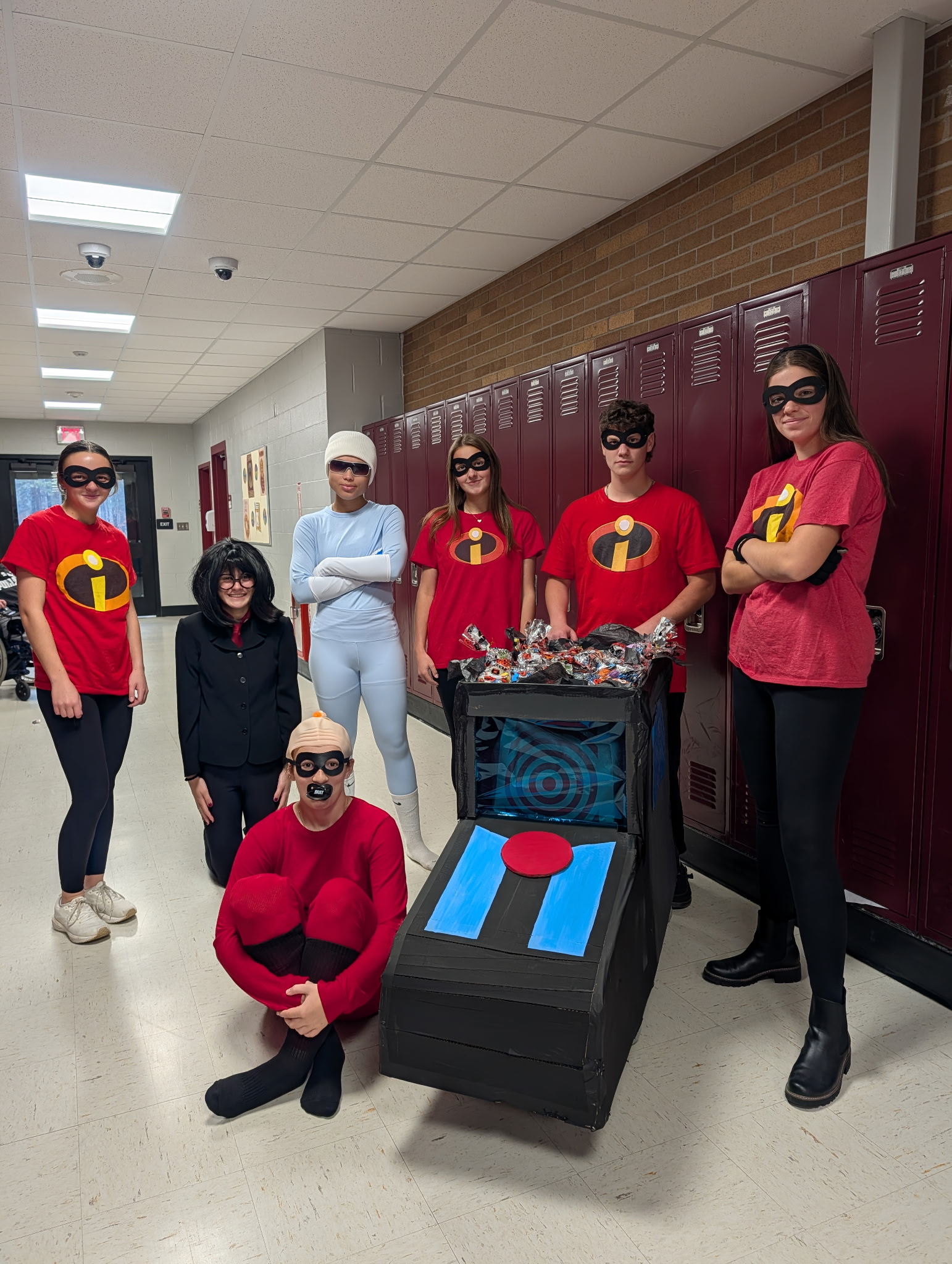 Students dress as the Incredibles for Halloween.